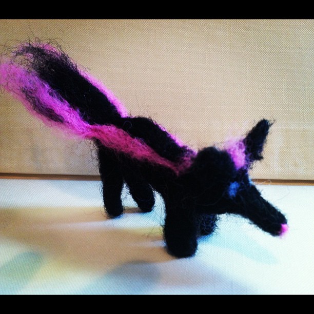 needle felted pink skunk